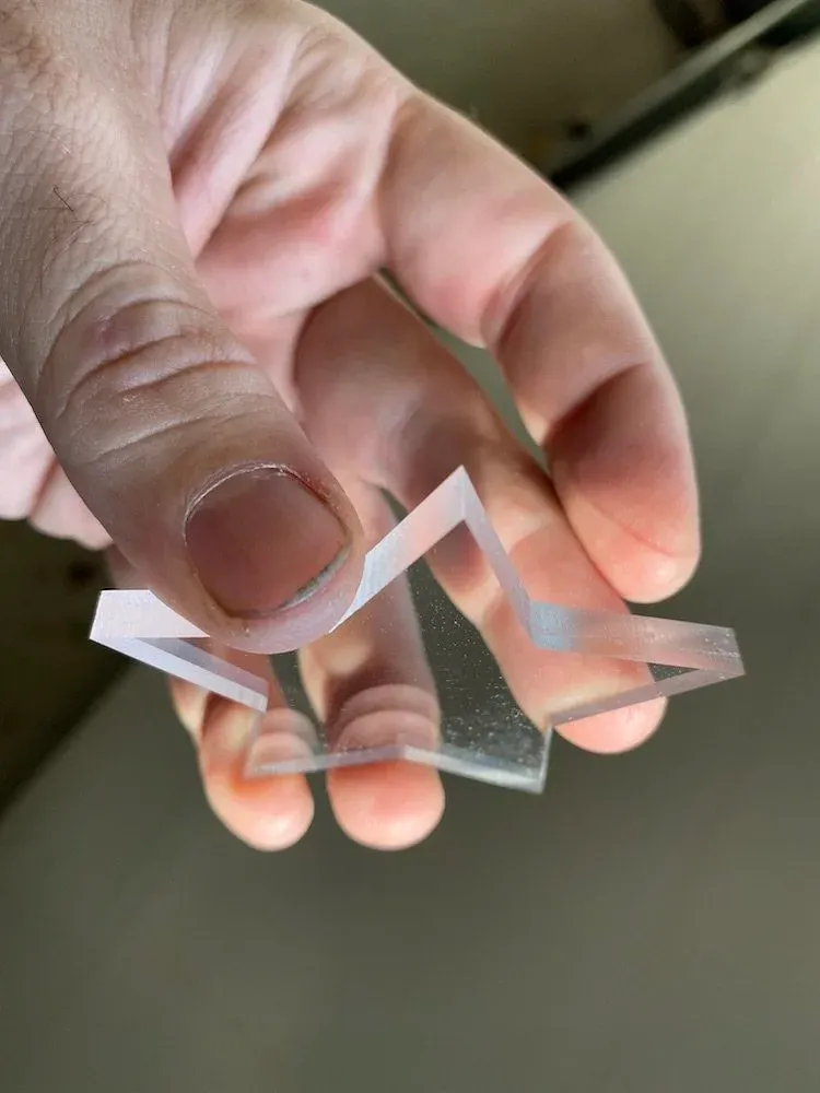Clear acrylic star showing the clean edge quality of CNC routing