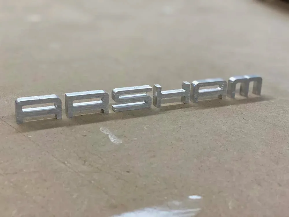 Machined lettering piece made for Daniel Arsham
