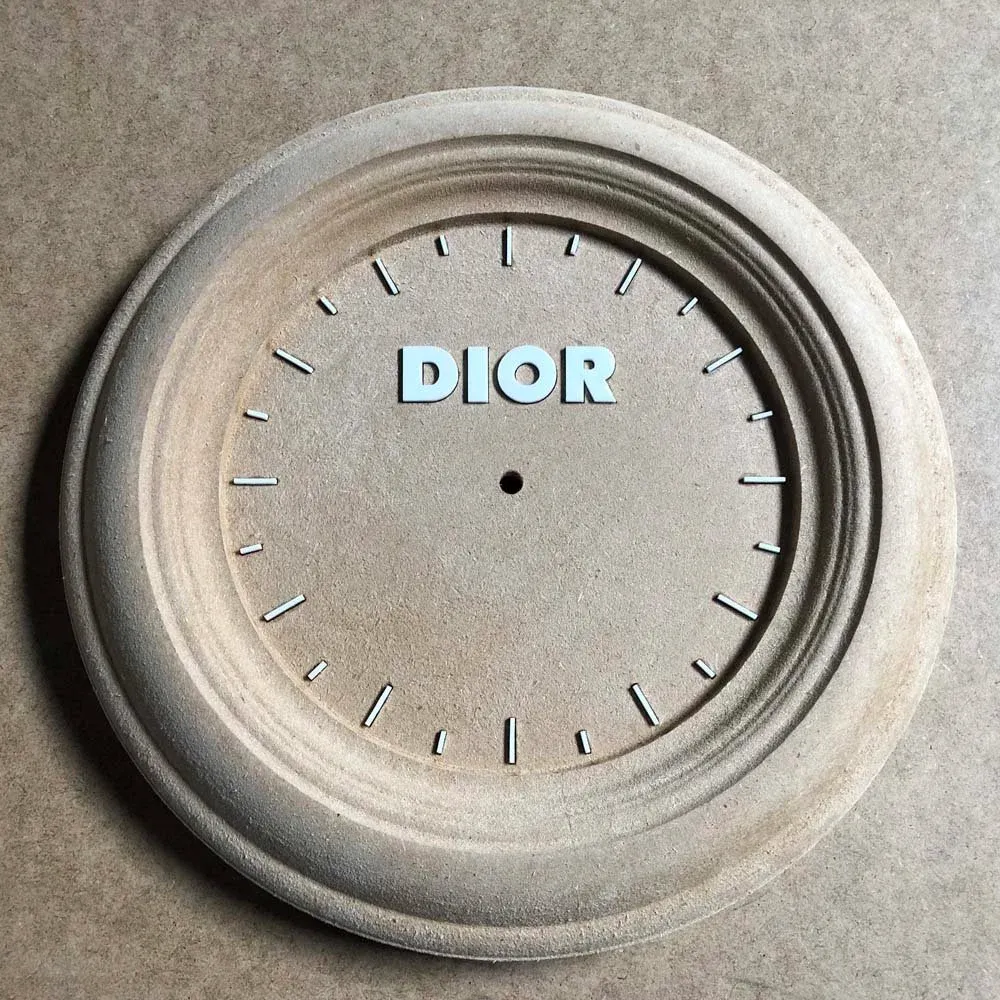 Three-dimensional clock base CNC-routed in MDF with laser-cut acrylic details, made for Dior