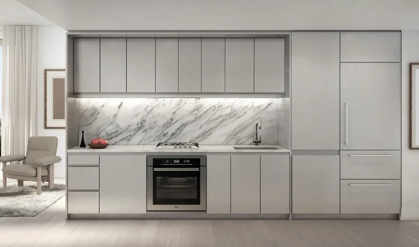 Minimalist residential kitchen with a marble backsplash and integrated appliances, designed by DIVISION Architecture